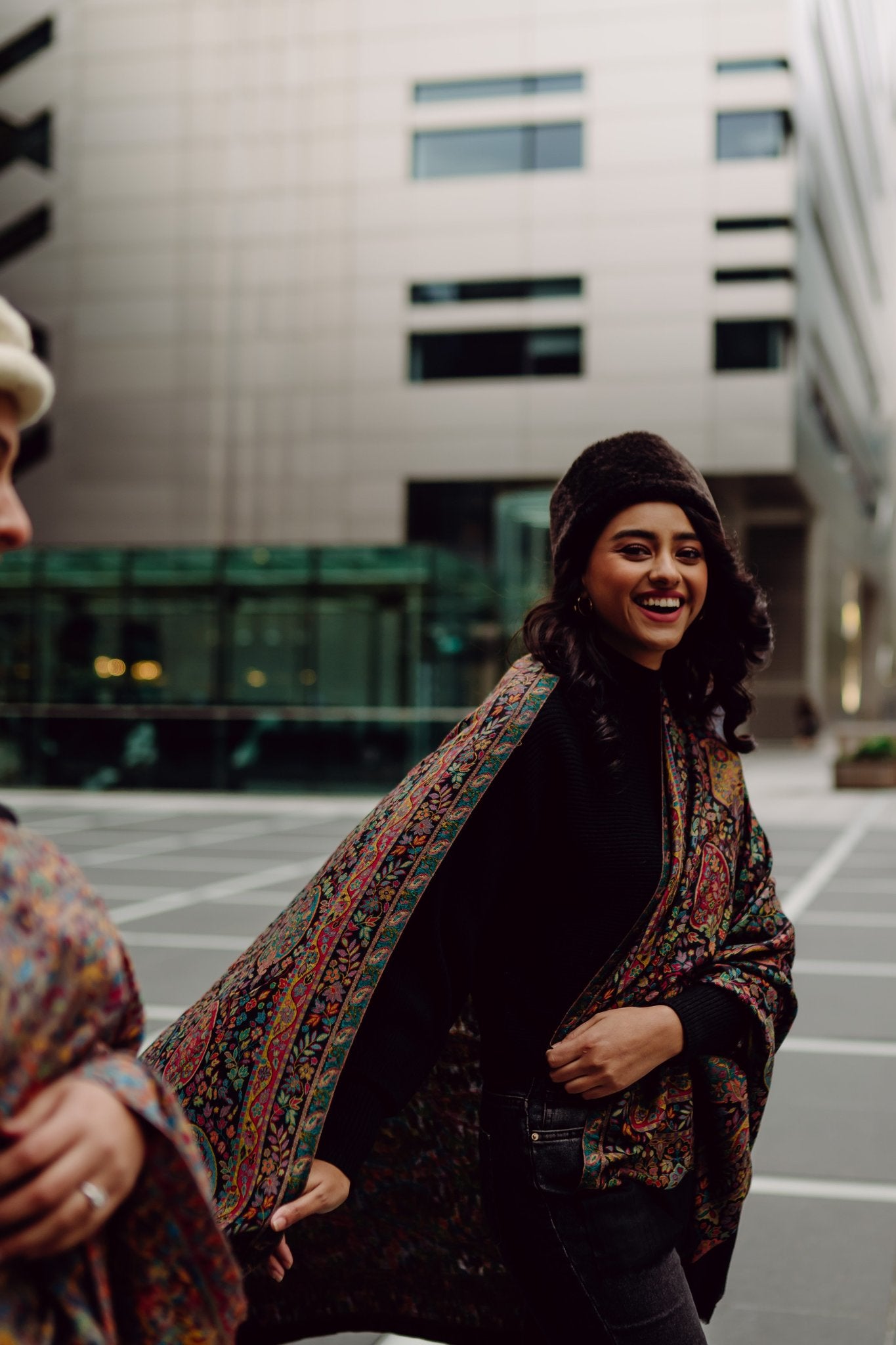 Woman wearing a patterned kani shawl