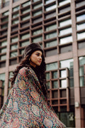 Woman wearing a patterned kani shawl