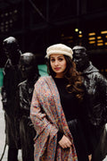 Woman wearing a patterned kani shawl