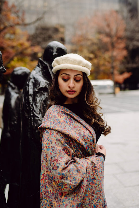 Woman wearing a patterned kani shawl