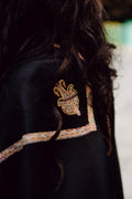 A black mixed wool shawl with golden borders