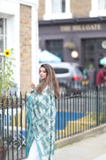 Woman wearing teal nalki embroidered shawl