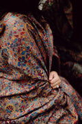 Woman wearing a patterned kani shawl